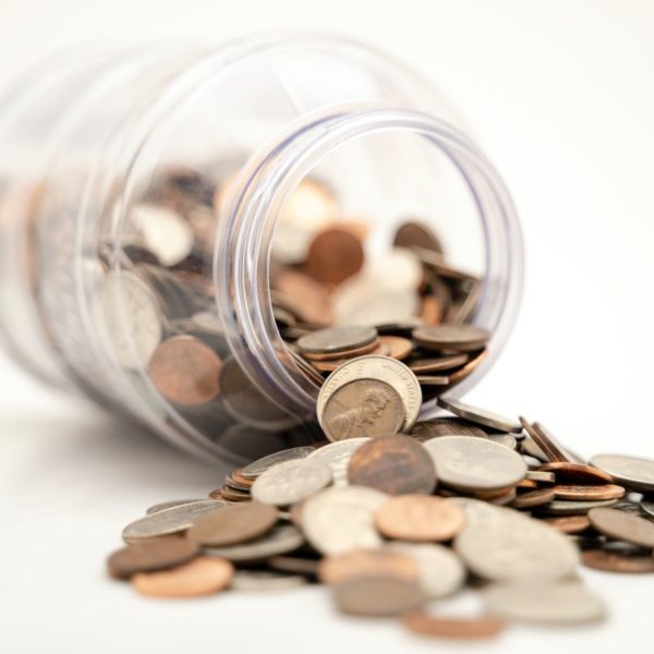 Jar with coins falling out