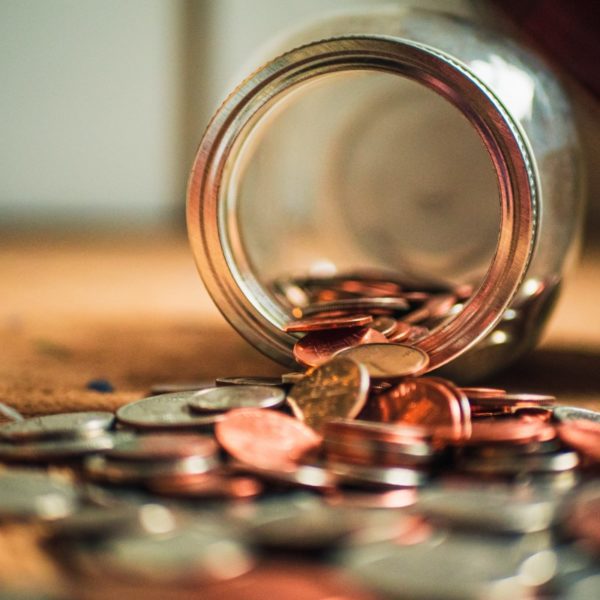 Coins falling out of jar