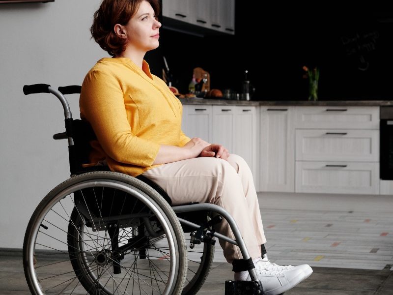 Woman in wheelchair in kitchen
