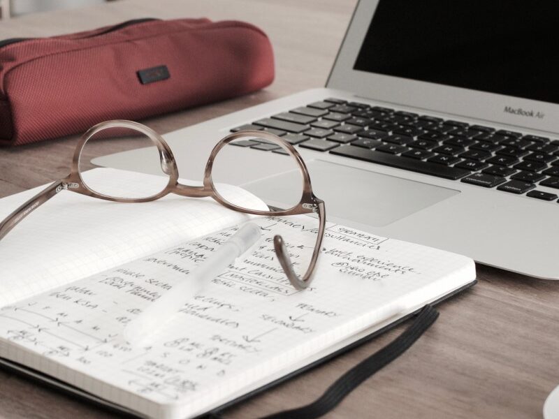 Laptop, notepad and glasses